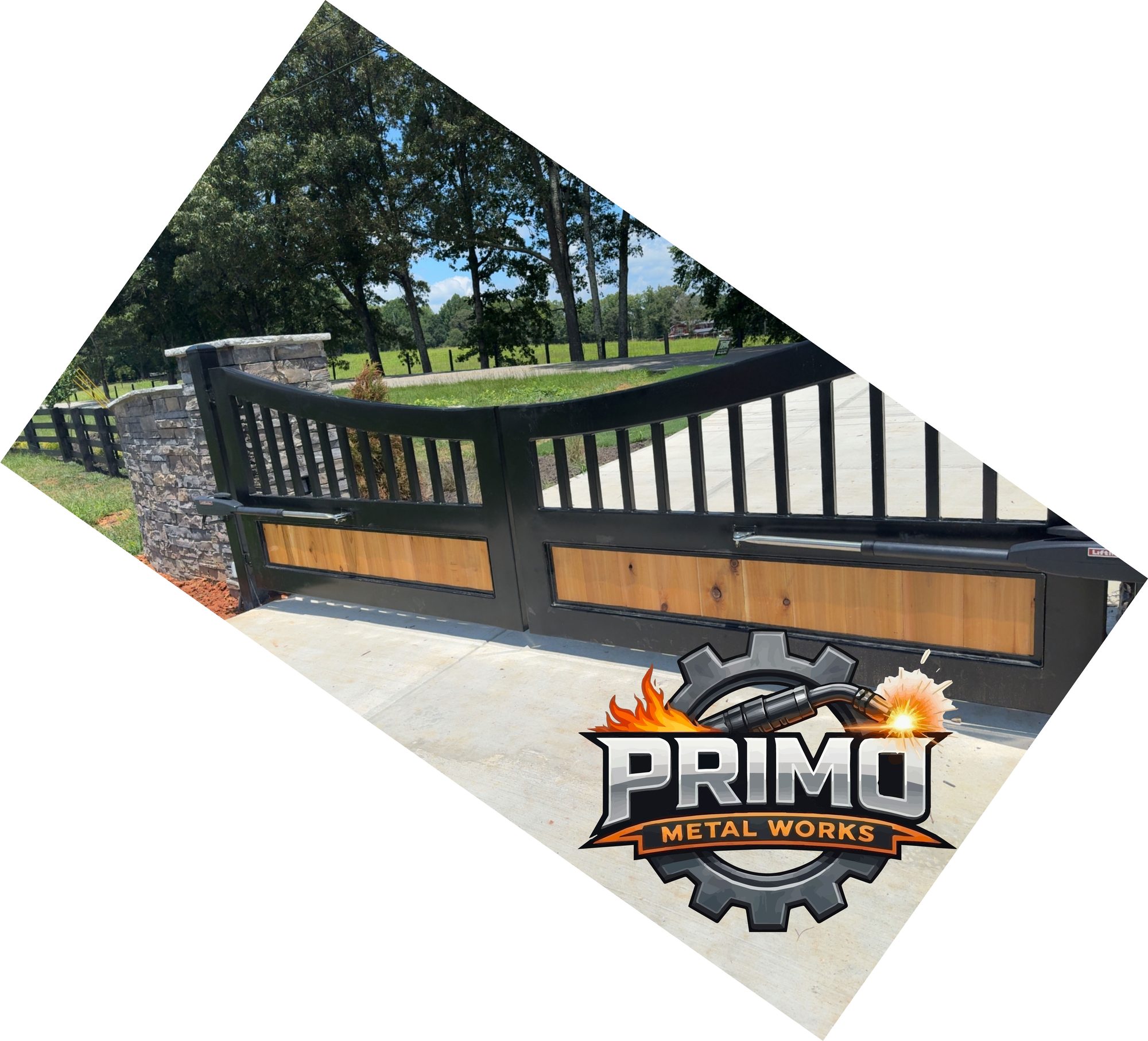 Ornamental steel gate with scrollwork and vertical bars in a grassy opening. The Primo logo is in the lower right